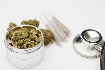 marijuana buds, joint, phonendoscope, with white background.