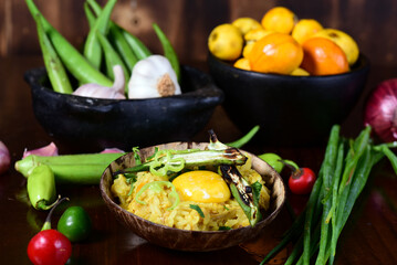 delicious chicken, typical Brazilian food, rice with chicken seasonings, salad and melted cheese au gratin on blurred background