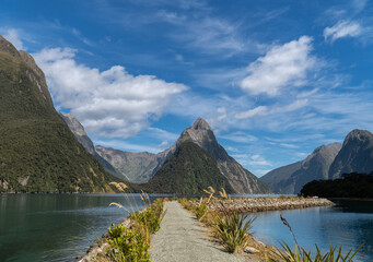 Mitre Peak in Milford Sound on a Sunny Summers Day in Fiordland National Park in the South Island of New Zealand - obrazy, fototapety, plakaty