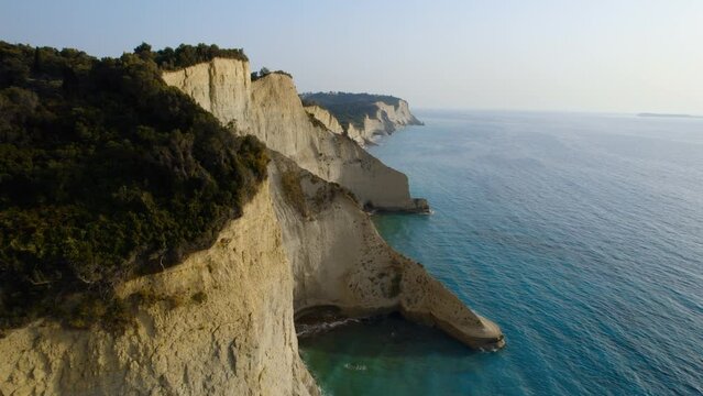 Drone Over Coastline Cliffs And Sea At Sunrise Of Cape Drastis