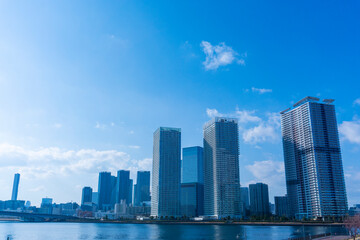 Tower apartments lined up along the river and a refreshing blue sky_16