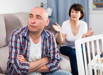 Sad family having difficulties in the living room at home. High quality photo