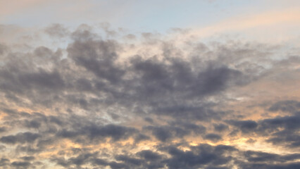Dark gloomy gray cloudy sky before thunderstorm in summer. Storm heaven, gloomy backdrop.