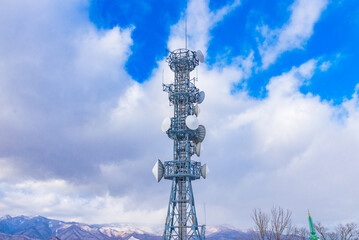 Telecommunication tower against the blue sky