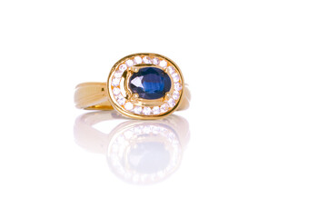 Ceylon Blue Sapphire and Diamond Jewel or gems ring on  white background with reflection. Collection of natural gemstones accessories. Studio shot