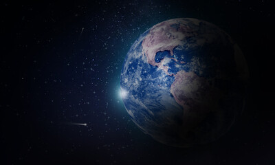 Planet earth in outer space with stars and universe particles background 