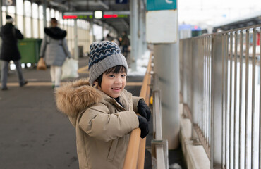 Cute Asian child Asian girl waiting for train
