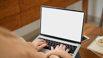 Fototapeta premium Close-up image, A female freelancer remote working at cozy coffee shop