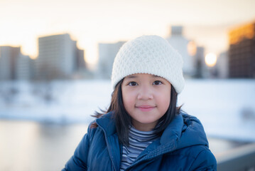 Portrait Of Cute Asian Girl Smiling On Winter Day