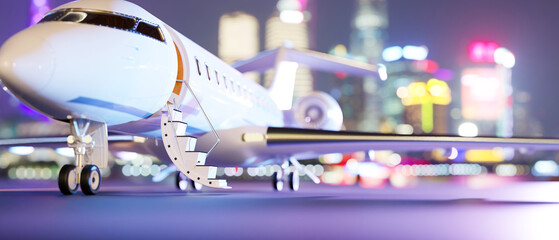 Private jet parked on runway over blurred city night lights in the background.