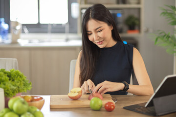 Woman preparing the ingredients in her kitchen. Cooking at home