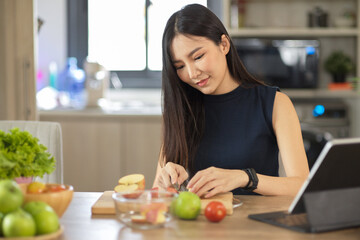 Housewife preparing food in the kitchen. Chopping an apples