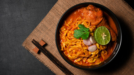 Top view, of Khao Soi Kai or noodles curry soup with chicken.