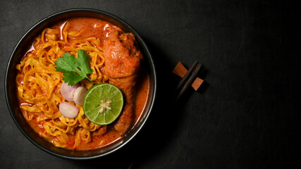 Overhead shot, Khao Soi Kai or chicken curry with seasoning and egg noodles