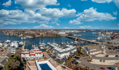 Aerial panorama of Annapolis harbor with luxury sail boats docked in the marina, drawbridge...