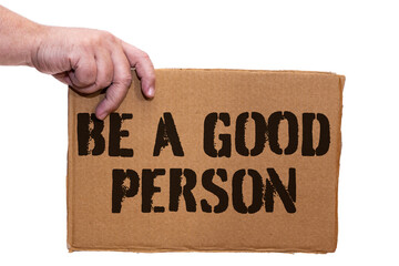 Cardboard poster with a legend of self-improvement on a white background. Hand holds the sign from the side.