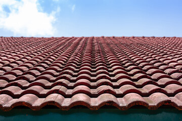Idea for house roof icon with red roof tiles. banner texture for roofing