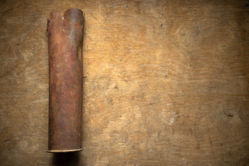 A large old tank sleeve on a wooden background. Artifacts of the Second World War.