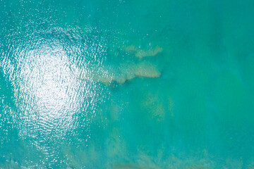 Fototapeta na wymiar Sea surface aerial view,Bird eye view photo of small waves and water surface texture Turquoise sea background Beautiful nature Amazing view
