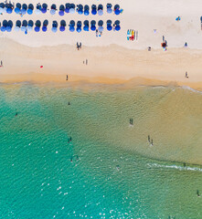 Aerial view Amazing sandy beach and small waves Beautiful tropical sea in the morning summer season image by Aerial view drone shot, high angle view Top down sea beach sand