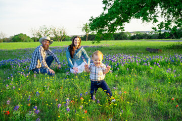Fototapeta premium Family in Meadow of Flowers