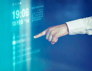 A cropped shot of a man using futuristic touch technology. All screen content is designed by us and not copyrighted by others, and upon purchase a user license is granted to the purchaser. A property