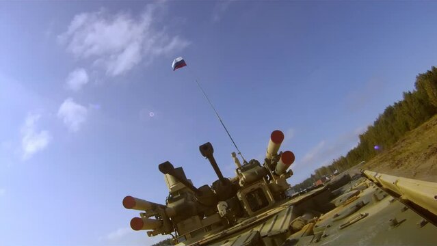A new modern tank support vehicle Terminator-2 is walking through a military training ground, demonstrating the power and formidable modern weapons of heavy Russian armored vehicles.