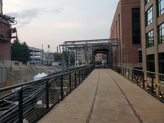 Fototapeta na wymiar bridge in the city, downtown industrial setting, old train tracks, steel beams