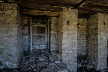 an old locked door in a stone abandoned city
