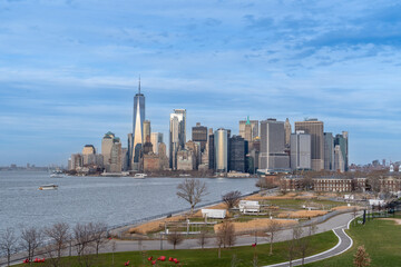 Skyscrapers of Manhattan with blue sky as seen from Governors Island New York