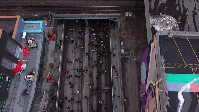 Crowd marching on street reversing tilt Calgary Protest 12th Feb 2022