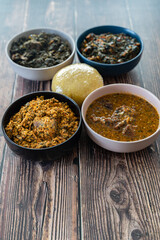 Egusi Ogbonno, Vegetable and Afang soup with pounded yam and Eba Garri