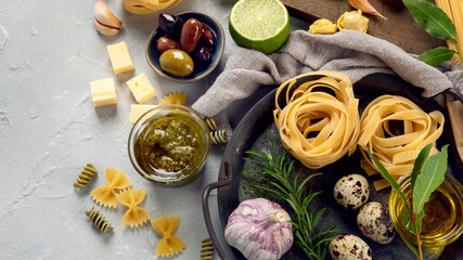 Italian pasta assortment on light background.