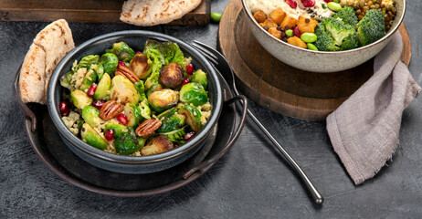 Brussel sprout salad with bulgur on dark background.