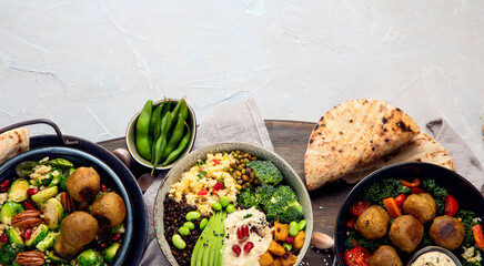 Vegan dishes assortment on light background.