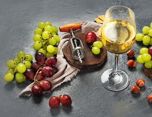 Different wine in glasses on gray background.