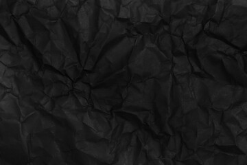 black crumpled paper texture as background