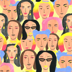 Seamless pattern with different young woman faces, colorful hair on yellow background