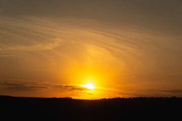 Obraz premium Dark yellow sunset in summer.