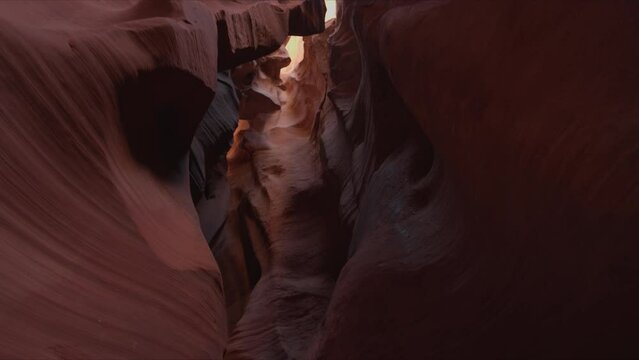 Cinematic scenery inside narrow Upper Antelope Canyon as seen from below. Amazing natural gem with high red sandstone walls. High quality 4k footage