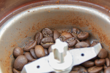 Coffee in a coffee grinder.