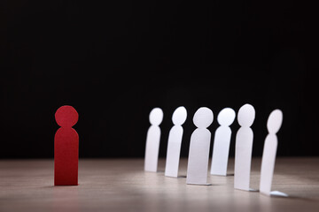 Racial exclusion concept cutouts of people and a different one