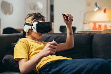 teenager using virtual reality set for playing