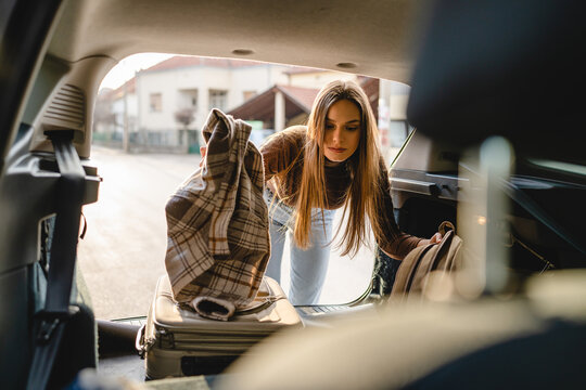 One Young Beautiful Woman Student Travel Concept Female Take Luggage Baggage Suitcase And Other Stuff And Belongings From The Back Of Her Car While Moving Into Dormitory On College Campus Real People