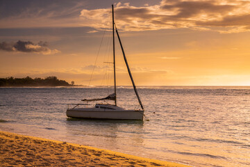 sail boat on the sea at sunset