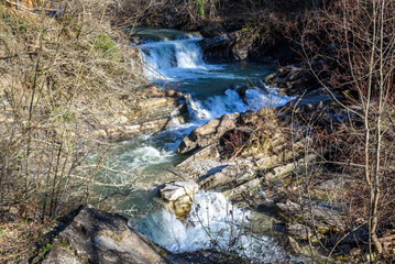 Waterfall on Zhane river on sunny winter day. Krasnodar Krai, Gelendzhik, Russia