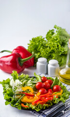 Fresh vegetables on a plate. Tomatoes, cucumber, pepper, onion. Healthy eating concept. Diet concept