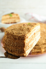 Concept of tasty dessert with honey cake, close up