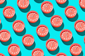 Lots of round alarm clocks showing different times