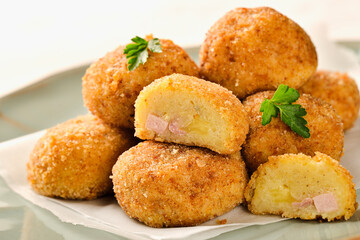 Homemade POTATO CROQUETTES stuffed with ham and cheese